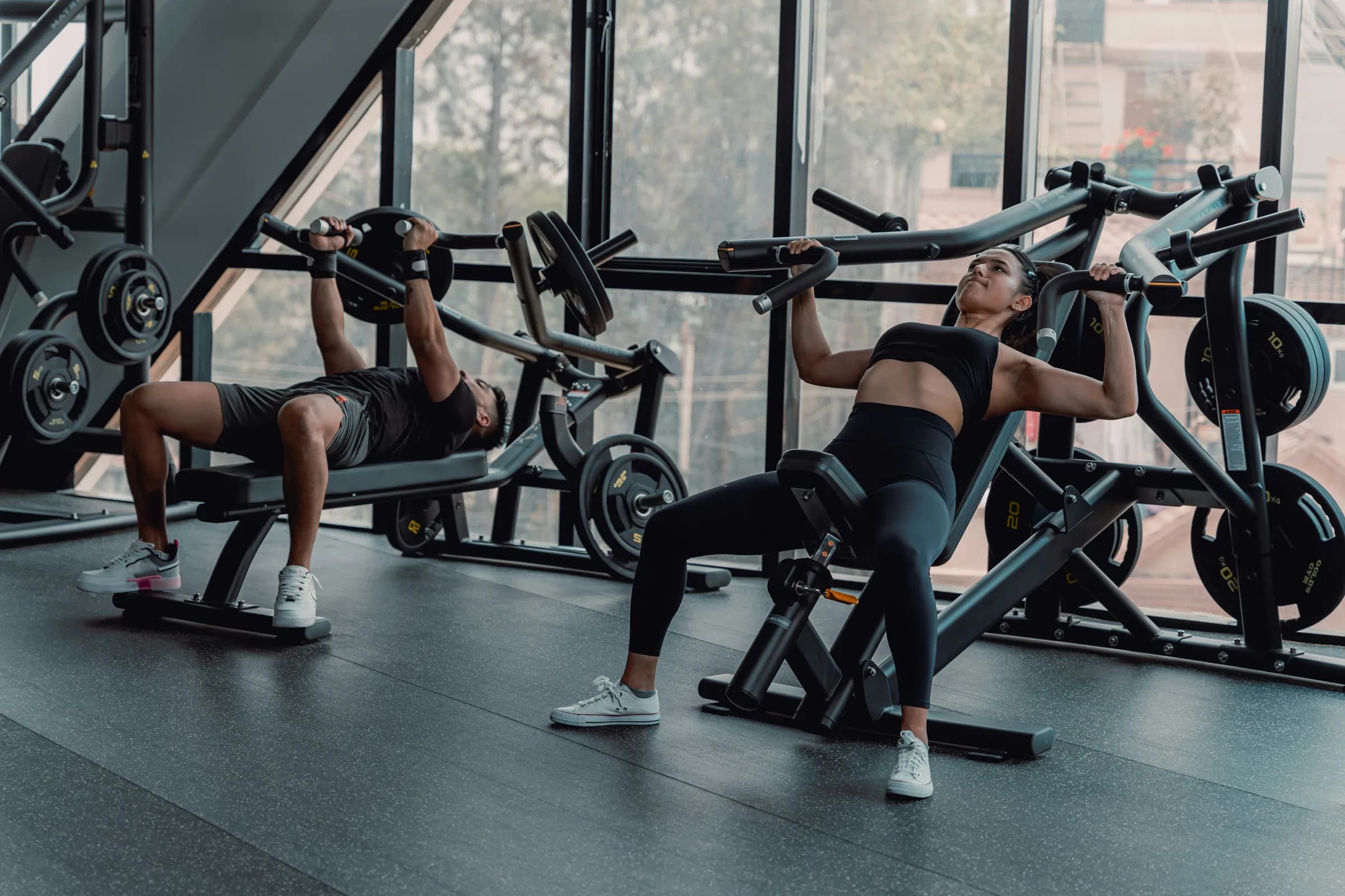 The floor of a gym, racks and machines